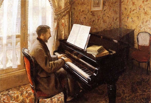 ピアノを弾く若い男